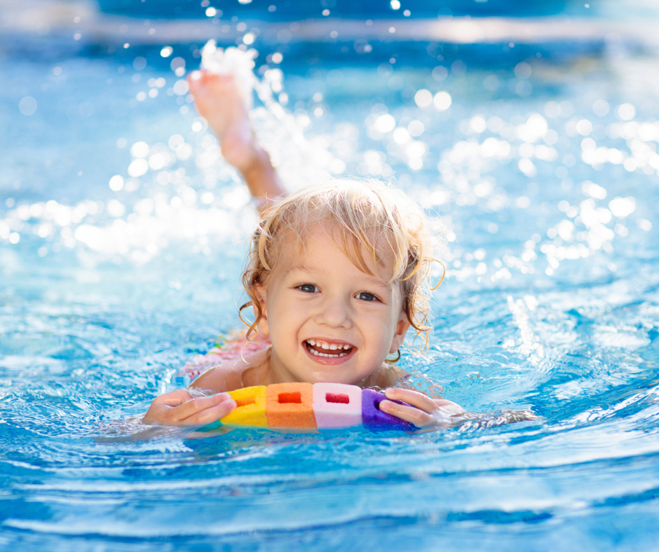 image of a kid swimming in the pool