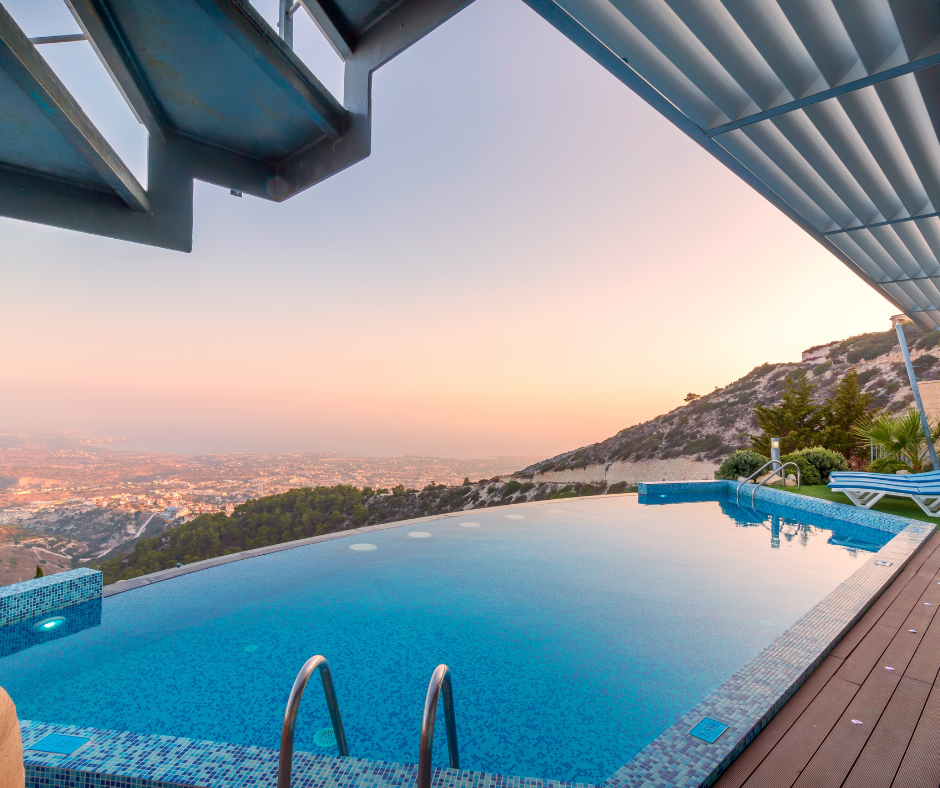 swimming pool by the mountain with sunset view